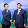 越南政府总理范明正会见中国司法部长贺荣。（图片来源：VGP）