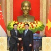 越南国家主席梁强会见新加坡总理黄循财。