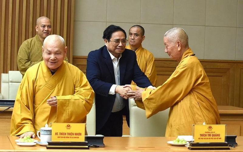 越南政府总理范明正会见越南佛教协会代表团。（陈海 摄）