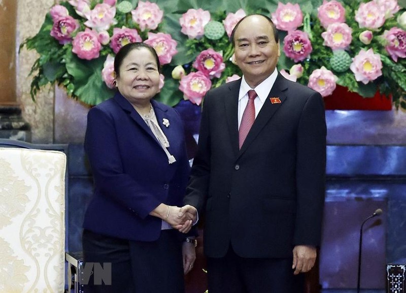 越南国家主席阮春福和老挝人民革命党中央组织部部长西赛•乐迪蒙颂。（图片来源：越通社）