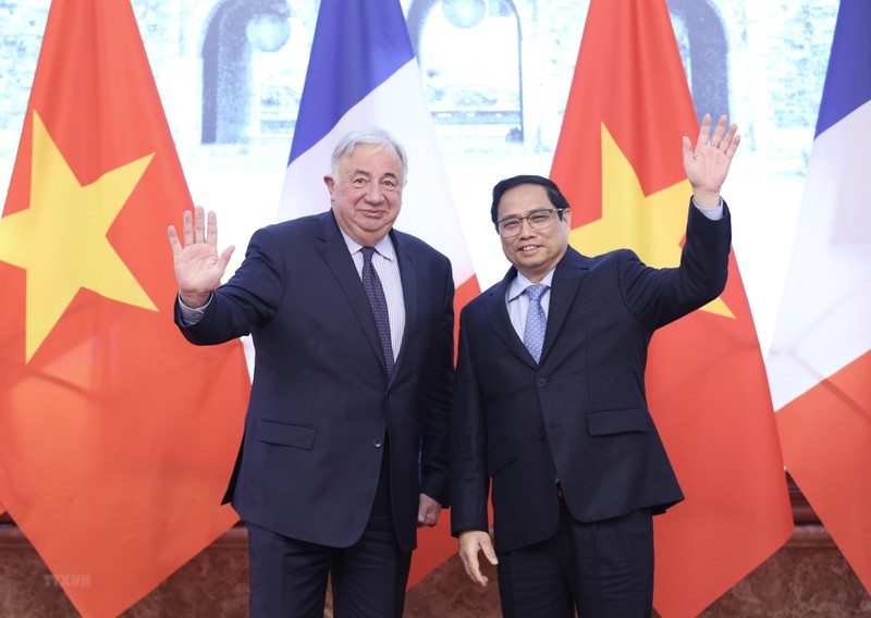 越南政府总理范明正和法国参议院议长热拉尔·拉尔歇。（图片来源：越通社）