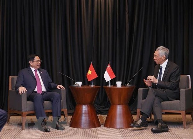 越南政府总理范明正与新加坡总理李显龙。（图片来源：越通社）
