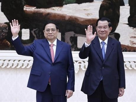 越南政府总理范明正和柬埔寨首相洪森。（图片来源：越通社）