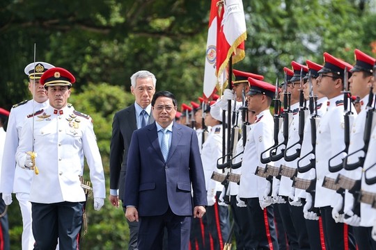 越南政府总理范明正2月8日至10日对新加坡进行正式访问。（图片来源：越通社）
