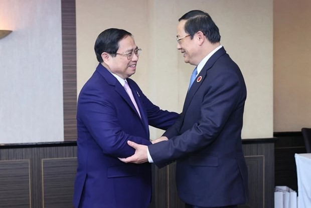 越南社会主义共和国政府总理范明正与老挝人民民主共和国政府总理宋赛·西潘敦。