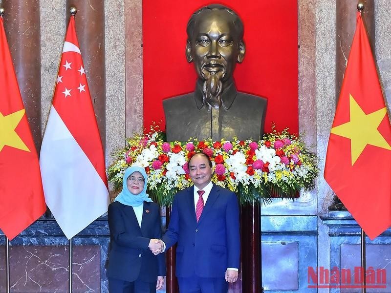 越南国家主席阮春福与新加坡总统哈莉玛·雅各布。（水原 摄）