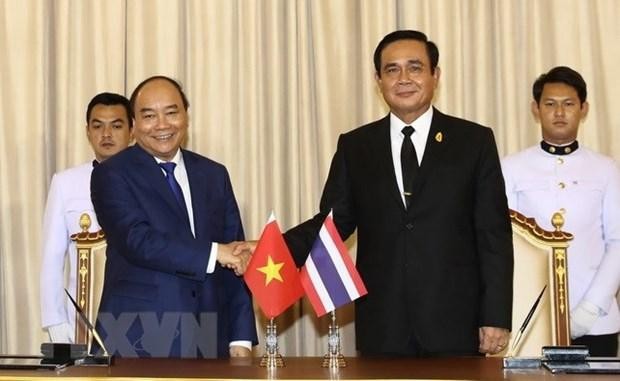 资料图：越南国家主席阮春福和泰国总理巴育。（图片来源：越通社）