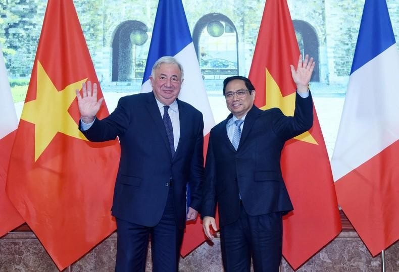 越南政府总理范明正与法国参议院议长热拉尔·拉尔歇。（陈海 摄）