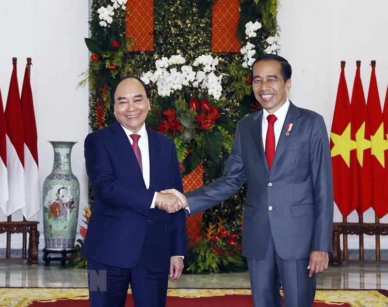 越南国家主席阮春福与印尼总统佐科·维多多。（图片来源：越通社）