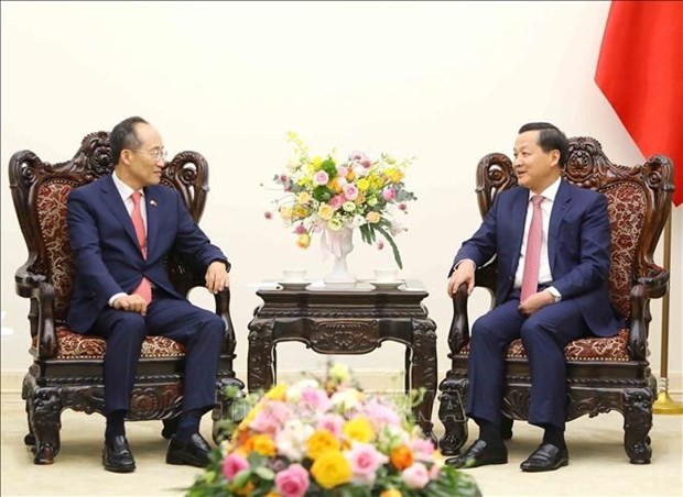 越南政府副总理黎明慨会见韩国副总理兼财政经济部部长秋庆镐。