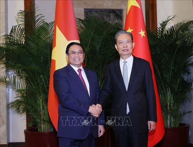 越南政府总理范明正会见中国全国人大委会长赵乐际。（图片来源：越通社）