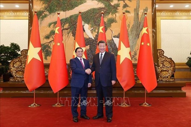 越南政府总理范明正与中共中央总书记中国国家主席习近平。（图片来源：越通社）