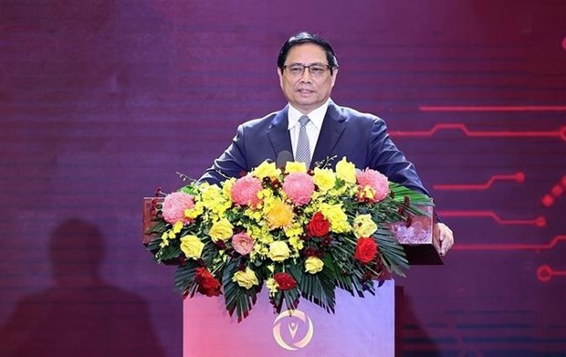 越南政府总理范明正在活动上发言。