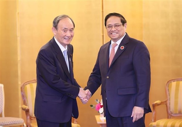 越南政府总理范明正会见日本前首相、越南-日本友好议员联盟顾问菅义伟。