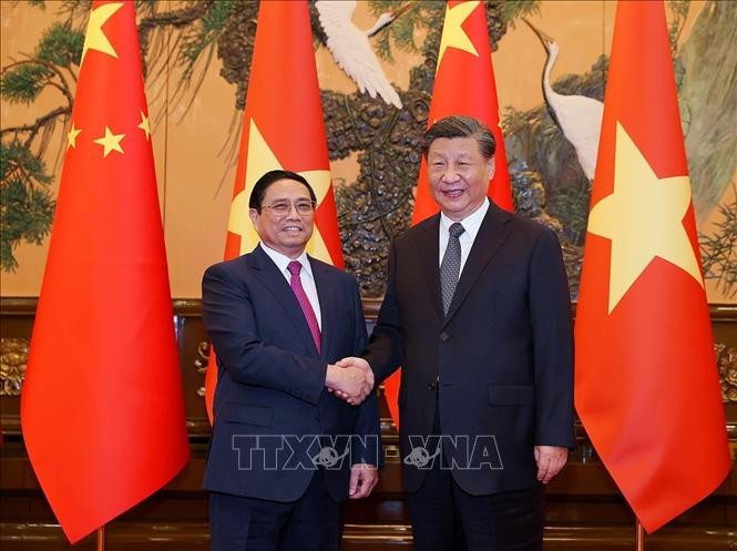 越南政府总理范明正会见中共中央总书记、中国国家主席习近平。（图片来源：越通社）