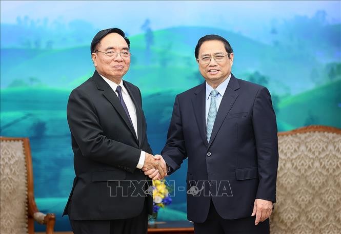 越南政府总理范明正会见老挝计划投资部长坎詹·冯福西。（图片来源：越通社）