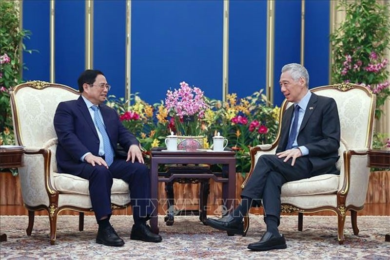 越南政府总理范明正与新加坡总理李显龙举行会谈。（图片来源：越通社）