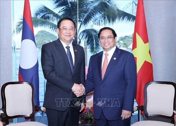 范明正总理会见老挝总理宋赛·西潘敦。（图片来源：越通社）