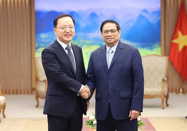 越南政府总理范明正会见三星电子首席财务官朴学奎。