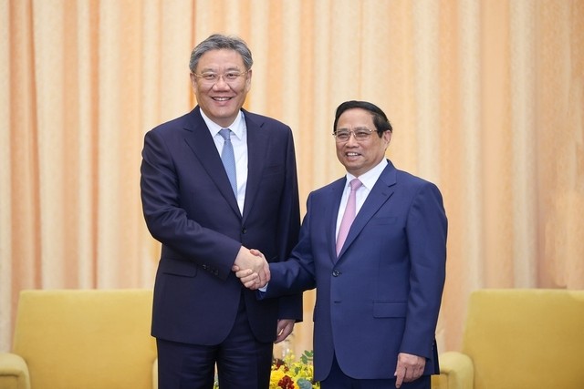 越南政府总理范明正会见中国商务部部长王文涛。