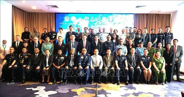 第14届东盟警察组织联络官会议与会代表合影。
