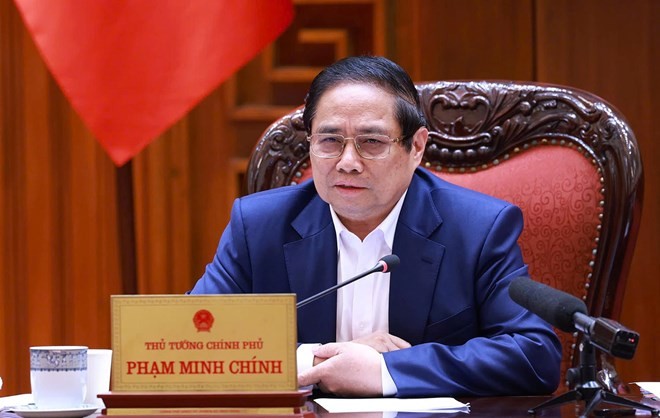 越南政府总理范明正要求尽早确定实行免费医疗的路线图。（图片来源：VGP）