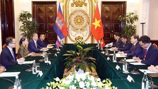 越南政府副总理黎明慨会见柬埔寨副首相梅森安。（图片来源：越通社）