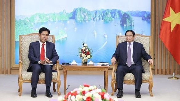 政府总理范明政会见老挝司法部部长帕维·西布阿利法。