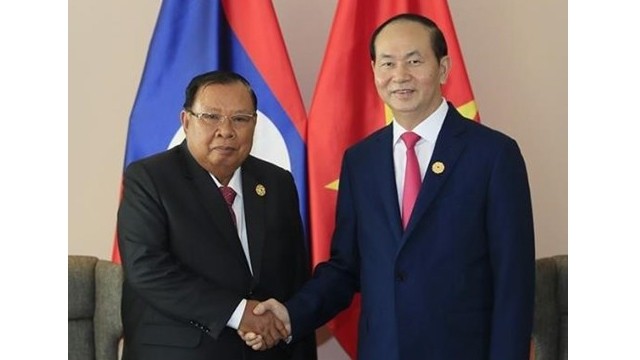 越南国家主席陈大光会见老挝人民革命党中央委员会总书记、老挝国家主席本扬•沃拉吉。（图片来源：越通社）