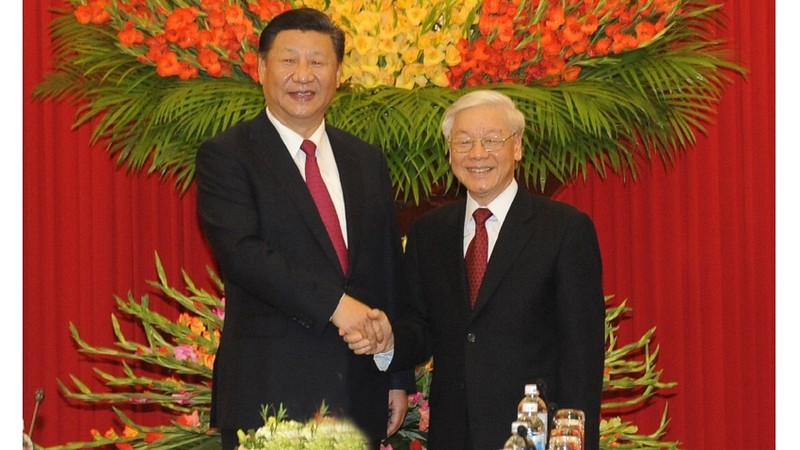 越共中央总书记阮富仲与中共中央总书记、国家主席习近平。