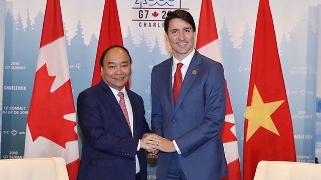 阮春福总理和加拿大总理贾斯汀•特鲁多。（图片来源：越通社）