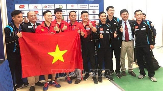 阮英秀、段伯俊英在乒乓球男子双人决赛以3比1击败来自新加坡的对手，夺得第二枚金牌。（图片来源：越通社）