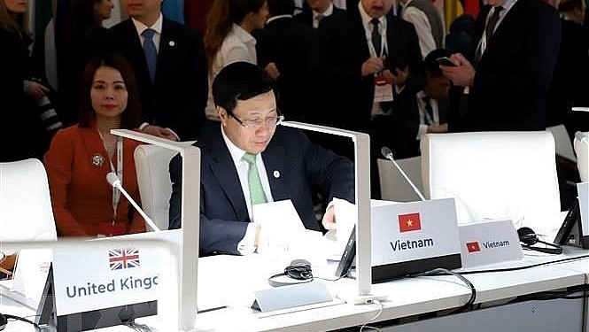 越南政府副总理兼外交部长范平明出席第十四届亚欧外长会议。