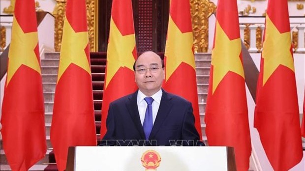 阮春福总理发表视频讲话。（图片来源：越通社）