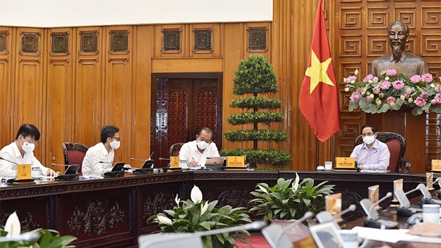越南政府总理范明正出席的政府常务会议。（图片来源：VGP）