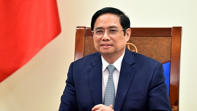 越南政府总理范明正与美国总统气候特使克里通电话。