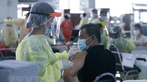 老挝敦促高危人群接种疫苗。（图片来源：新华社/越通社）