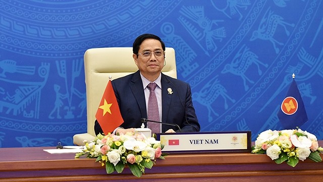 越南政府总理范明正出席此次峰会17个主要活动中的14个。（图片来源： 陈海 摄）