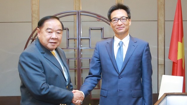 越南政府副总理武德儋会见泰国政府副总理兼泰国奥委会主席巴威。（图片来源：越通社）