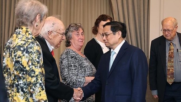 范明正总理会见支持越南橙剂受害者的美国友人。（图片来源：越通社）