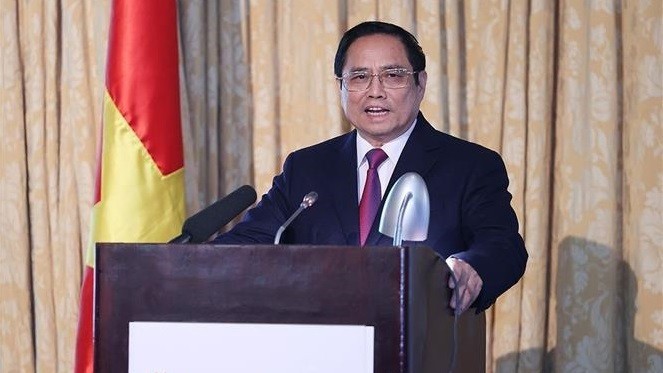 越南政府总理范明正在会上发表讲话。（图片来源：越通社）
